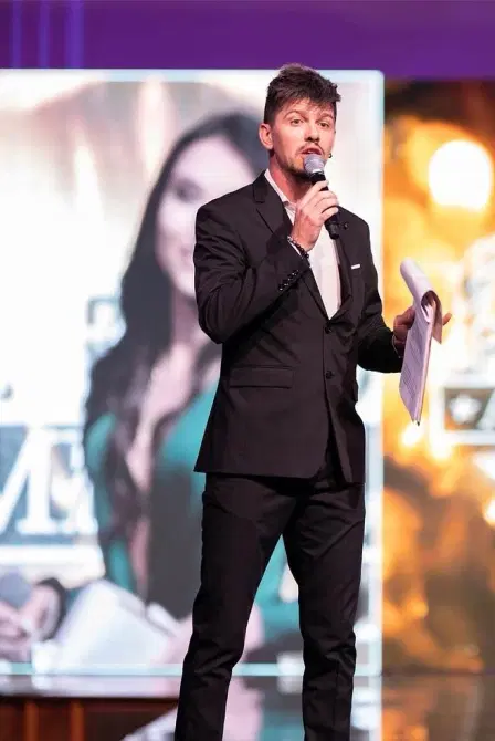 Aleksei Chebeliuk presenting on stage