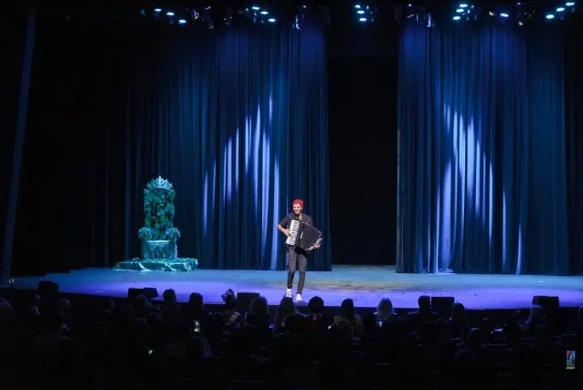 Aleksei Chebeliuk performing on a theater stage